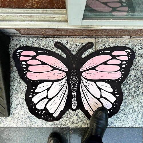 Pink butterfly shaped rug